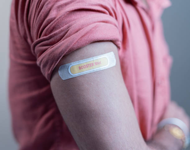 covid-19 or coronavirus vaccinated shoulder with booster shot sticker - concept of coronavirus 3rd dose vaccination. covid-19 or coronavirus vaccinated shoulder with booster shot sticker - concept of coronavirus 3rd dose vaccination booster dose stock pictures, royalty-free photos & images