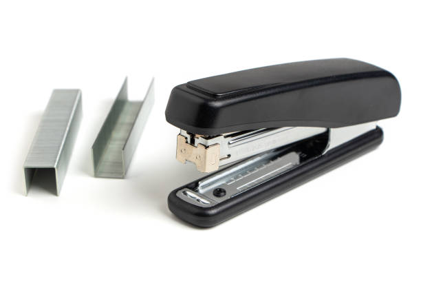 istock Black professional stapler isolated on white background 1336128259