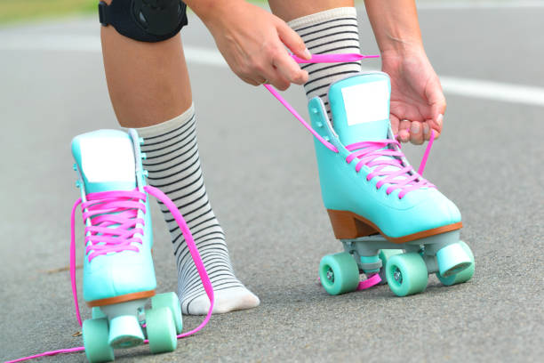 istock The woman is putting on roller skates 1336129314