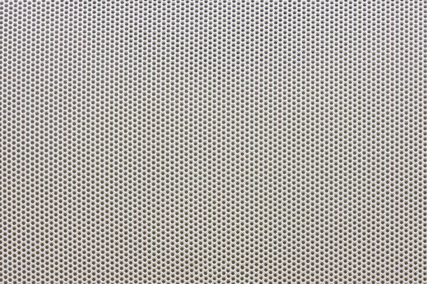 istock Silver speaker metal mesh texture, background with small holes 1336129443