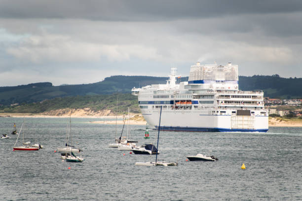 istock Sailing boats and a ferry ship 1336130595