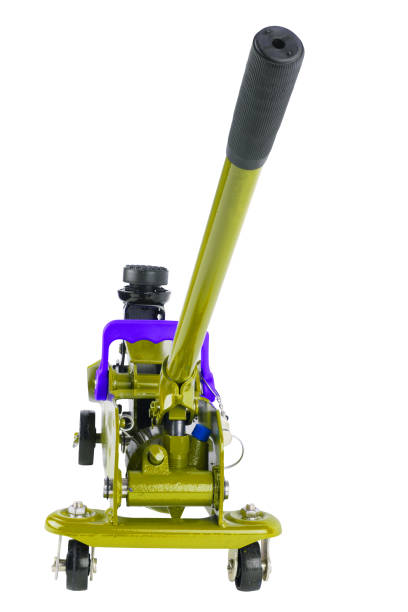 istock yellow hydraulic car jack isolated on white background, lowered 1336130925