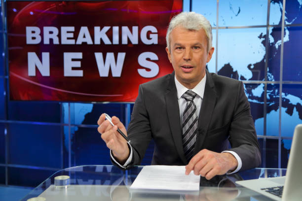 istock Breaking news senior male anchor 1336132171