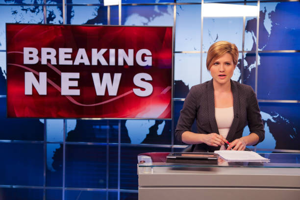 istock Breaking news female anchor 1336132229