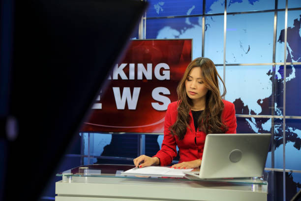 istock Female news anchor 1336132285