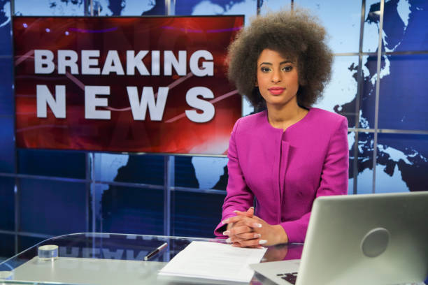 istock Breaking news female anchor 1336132322