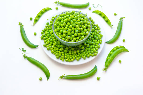 istock Close up fresh green peas in a glass bowl 1336132377