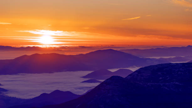 istock Foggy dawn in the mountains, drone view. 1336133191