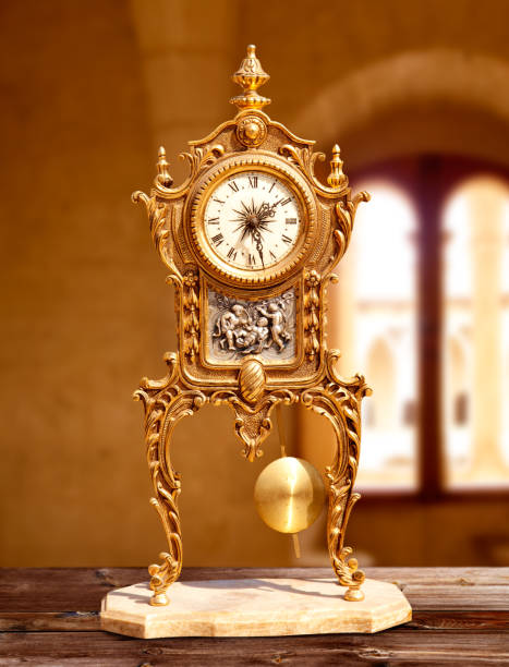 istock ancient vintage golden brass pendulum clock 1336134186