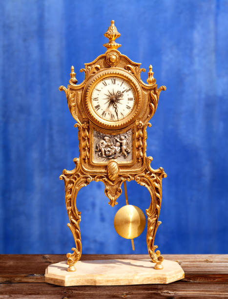 istock ancient vintage golden brass pendulum clock 1336134215