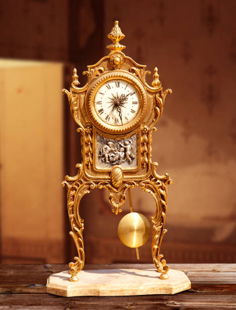 istock ancient vintage golden brass pendulum clock 1336134267