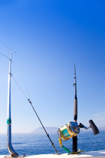 istock fishing boat trolling with outrigger gear 1336134483