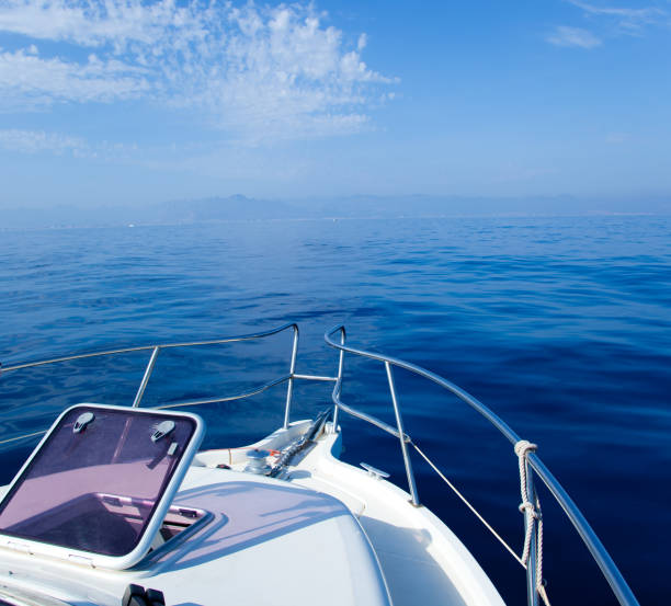 istock Blue sea boat sailing with open bow porthole 1336134673
