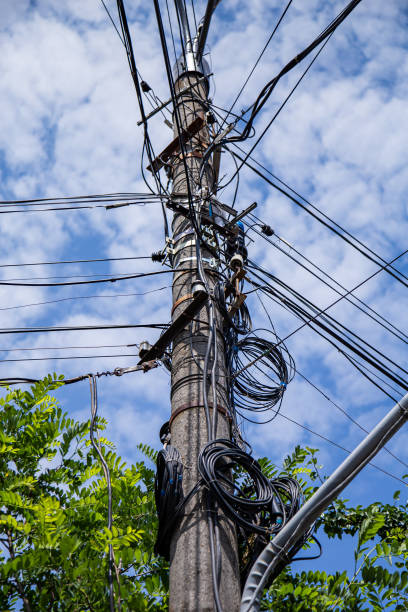 istock A fiber optic cable harness for communication weighs on a concrete column. Telecommunications and Internet 1336134721