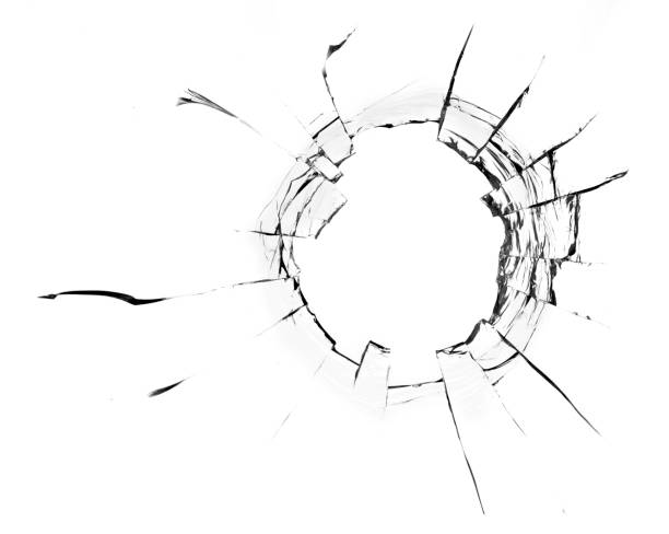 istock Hole from a ball in the glass, cracks on a white background 1336135760