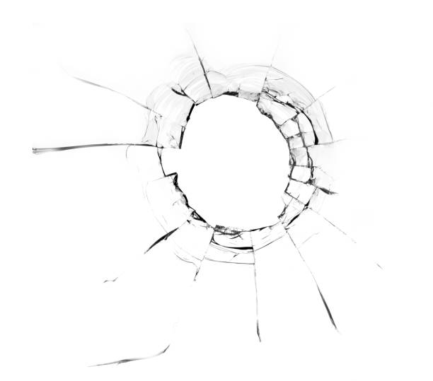 istock Hole from a ball in the glass, cracks on a white background 1336135761