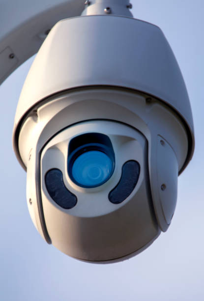 istock Swivel high quality CCTV camera on sky background. 1336136017