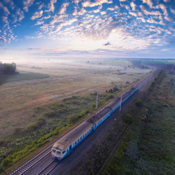 istock A freight train travels through a foggy forest. 1336137354