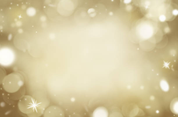 istock golden background with bokeh and sparkling particles 1336137450