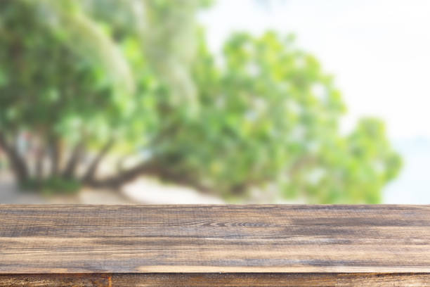 istock wood table top on blurred green wood background 1336140140