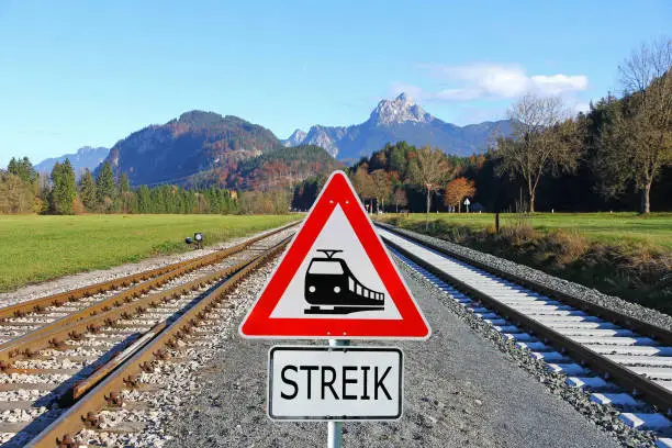 Strike at the railroad. Railroad tracks and a sign with a locomotive