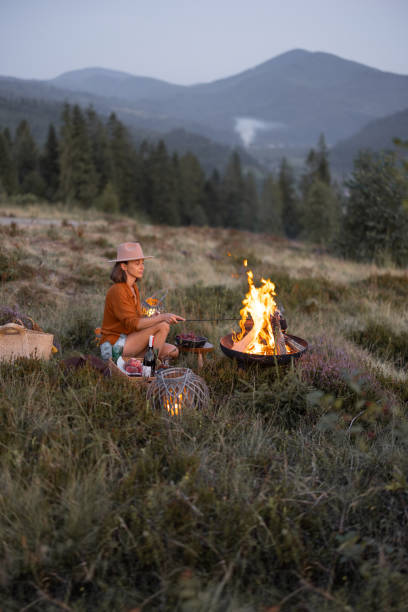 istock Woman at picnic in the mountains 1336142611