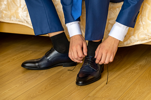 Business man or groom dressing up with classic elegant shoes.