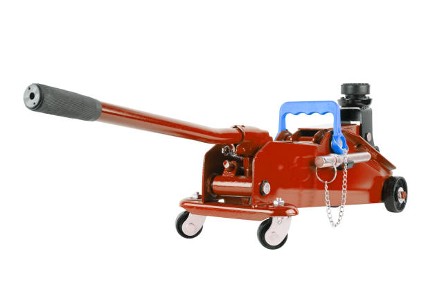 istock red hydraulic car jack isolated on white background, lowered 1336147099