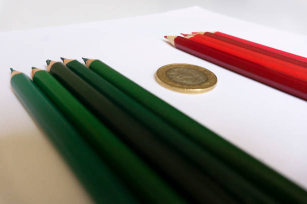 CDMX, Mexico - August 24, 2021: Mexican Flag, colored pencil and coin.