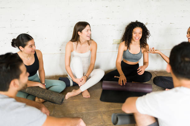 istock Young people resting after a yoga class 1336153650