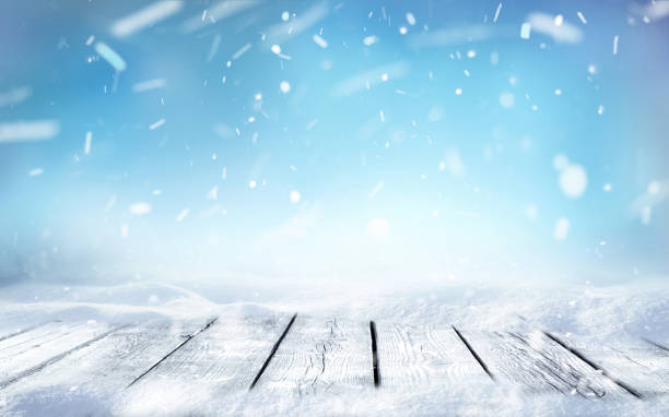 istock Beautiful winter background with snow and wooden surface. 1336156883