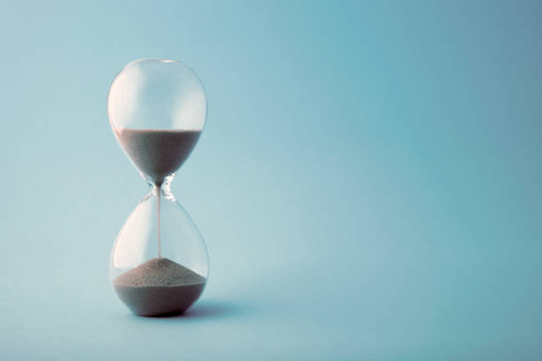 istock Hourglass time clock in blue tone 1336158475