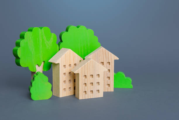 istock Residential buildings among the trees. Environmentally friendly, energy efficiency, zero carbon emissions. Carbon neutrality. Buying and selling real estate. Renting housing, Real Estate Agent services. 1336160399