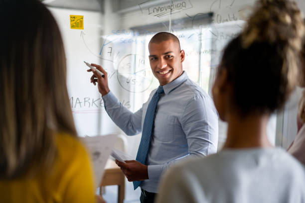 istock Man making a business presentation at the office 1336160914