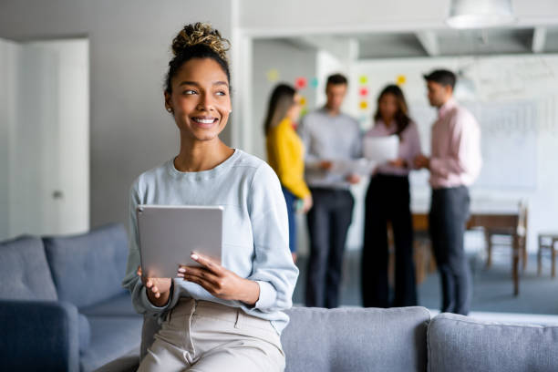 istock Business woman working at the office using a tablet 1336160950