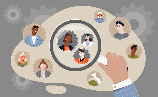 Hand holding magifier to find target audience among other people on grey background. Concept of target audience segmentation as customer group selection. Flat cartoon vector illustration