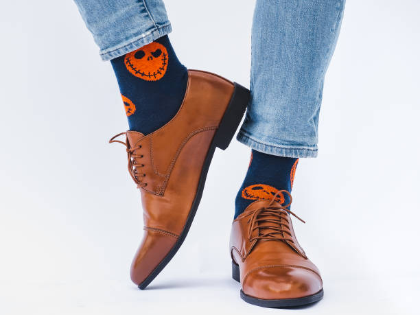 istock Men's legs, trendy shoes and bright socks 1336161713