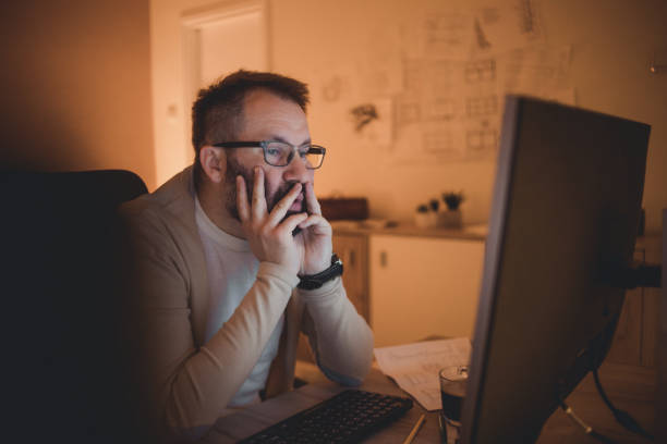 istock The man uses the computer at night, working late into the night. Late night work concept. New mormal concept. 1336162108