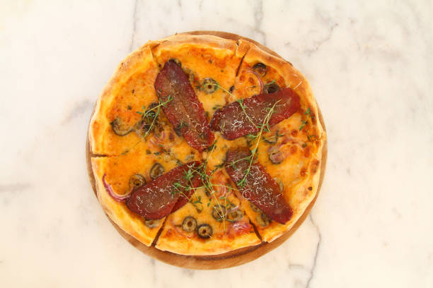 istock assorted pizza with different fillings: salami, tomatoes, mushrooms, bacon, sun-dried tomatoes. Horizontal frame 1336163003