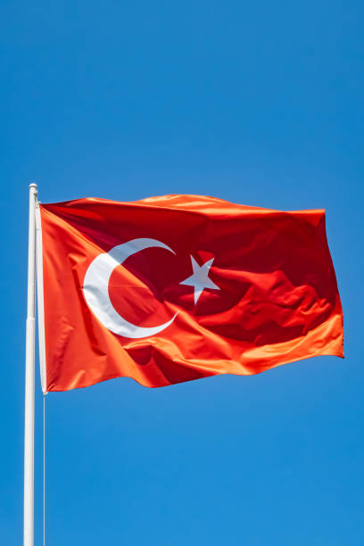 istock blue sky and waving turkish flag 1336165695