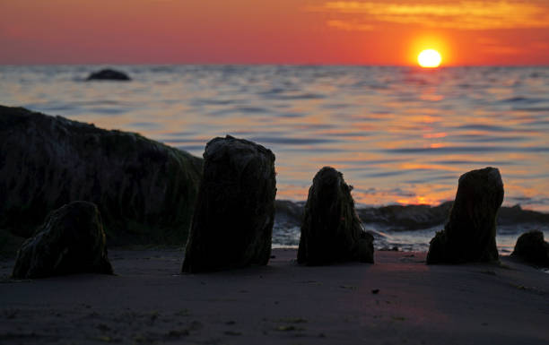 istock sea sunset old bridge stones  beams in the beach 1336166779