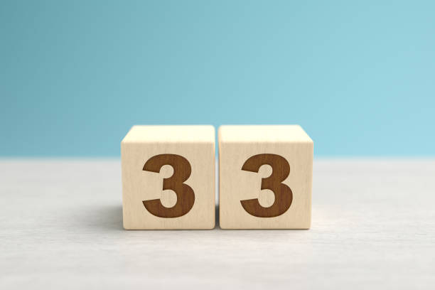 istock Wooden toy blocks forming the number 33. 1336169042