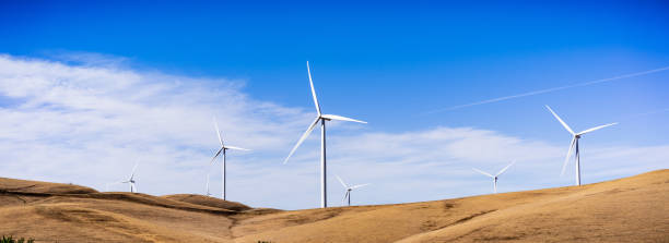 Panoramic view of wind turbines on the top of golden hills in Contra Costa County, East San Francisco bay area, California Panoramic view of wind turbines on the top of golden hills in Contra Costa County, East San Francisco bay area, California contra costa county stock pictures, royalty-free photos & images
