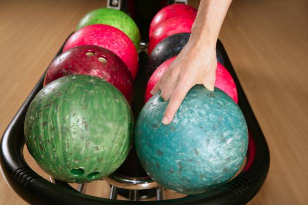 istock Bowling ball in player man hand 1336176059