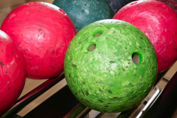 istock Bowling balls red green closeup row 1336176144