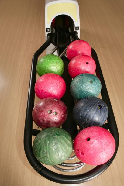 istock Bowling balls perspective in game center 1336176176