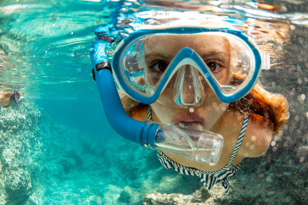 istock Girl snorkeling during cool vacation 1336177188