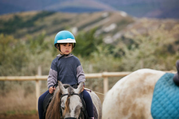 istock 5 Year Old Girl Horseback Riding 1336188369