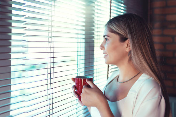 istock woman taking coffee break in office enjoying coffee 1336189000