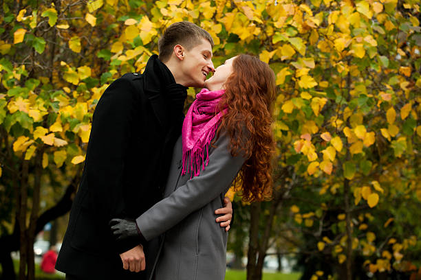 istock young loving couple in autumn park 133619031